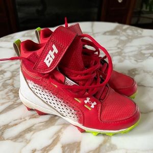 Under Armour little boys size 13 baseball cleats. Good condition. Wore 1 season